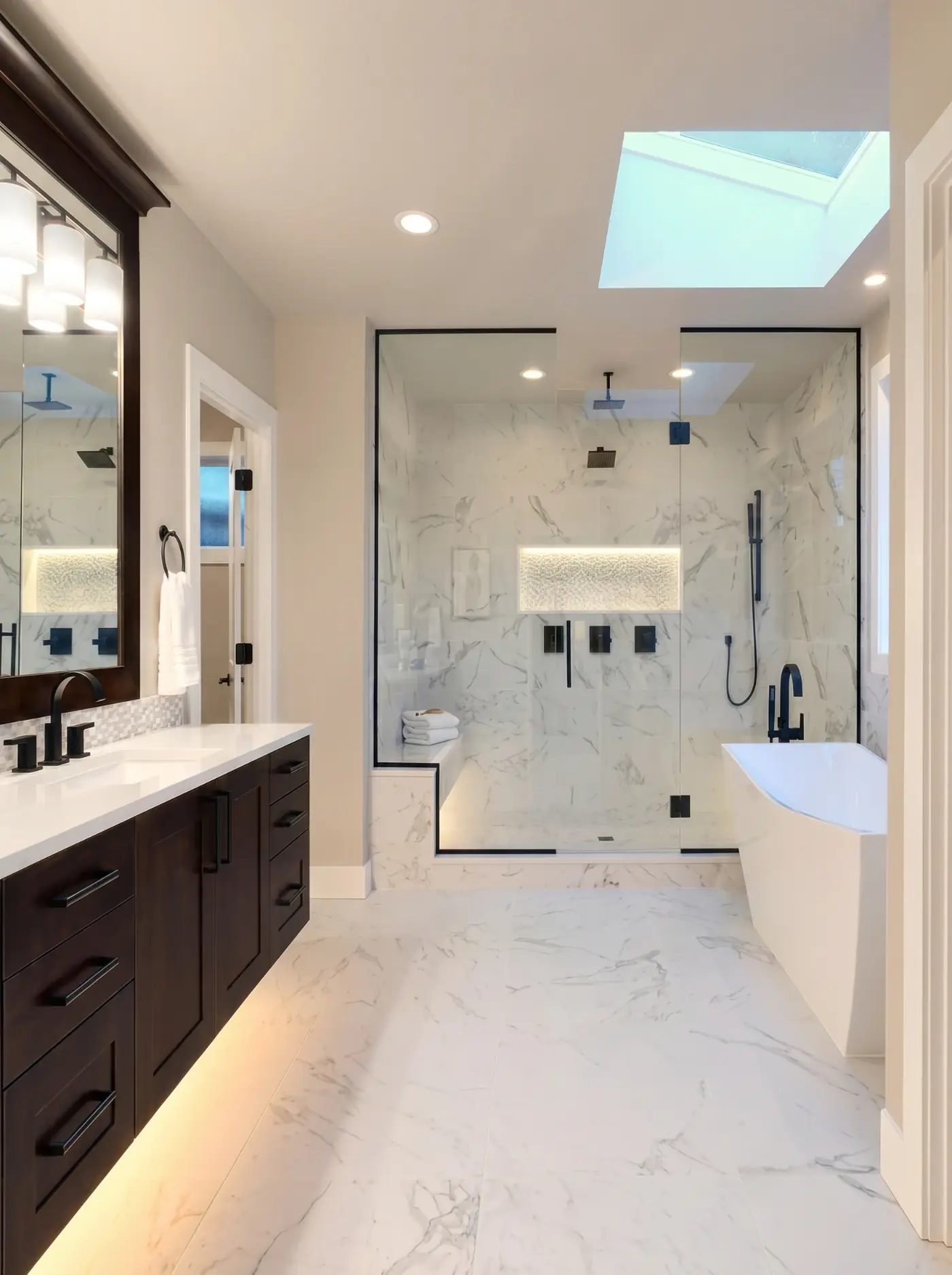 Modern luxury master bathroom with marble shower and freestanding bath by Alpha Tiling